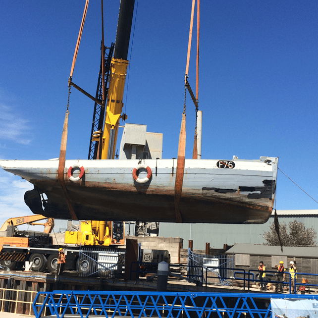 Gamecock being craned out of the water